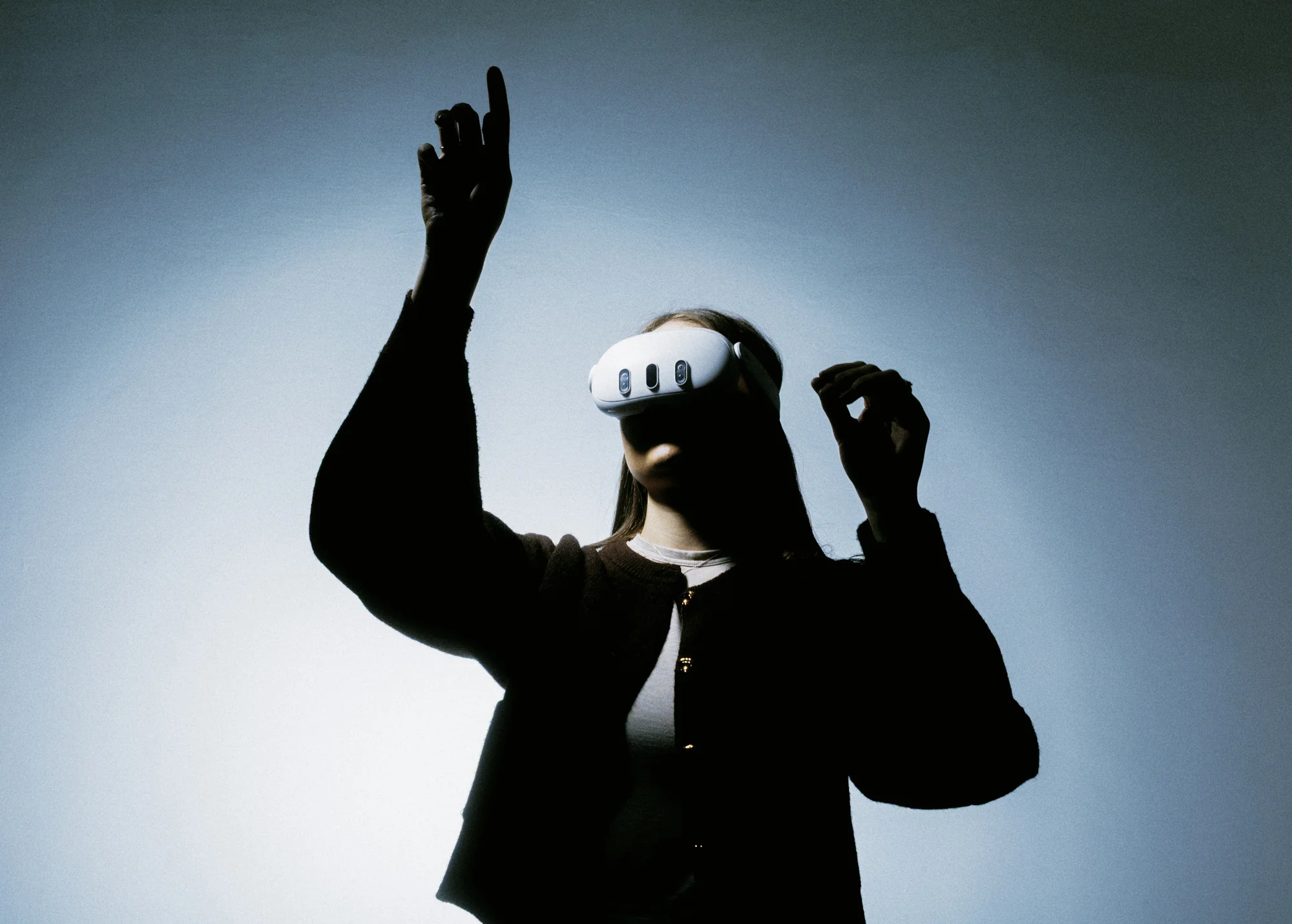 Learner in a VR headset reaching out to interact with a virtual model