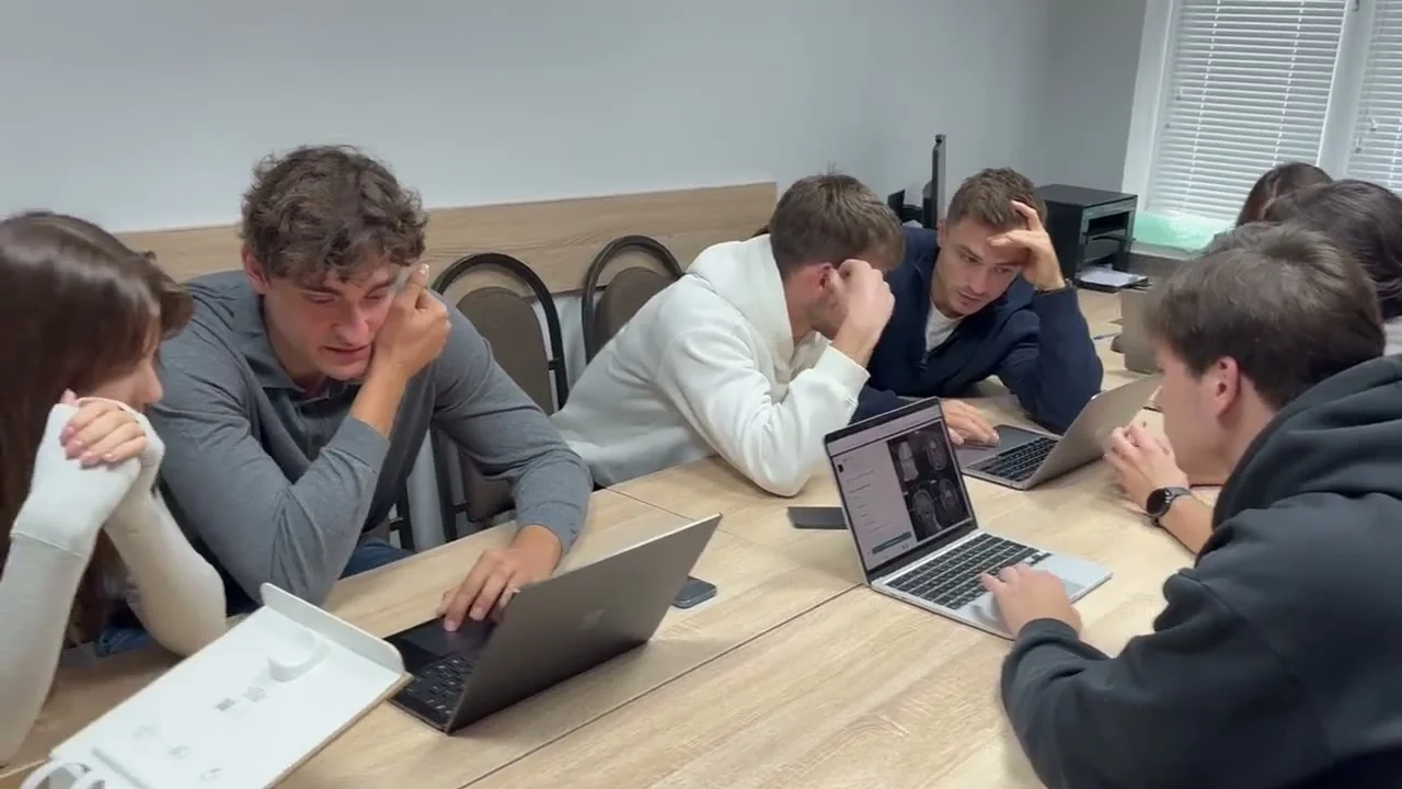 Surgical trainees working through an Argus case together on laptops